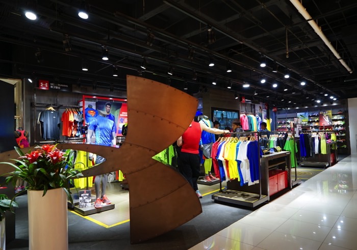 Under Armour will emphasize branded stores