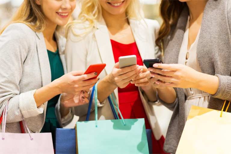 shoppers with smartphones