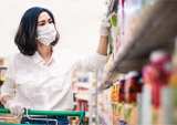 woman in face mask shopping