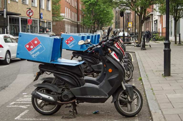 Domino's To Hire 20K Amid Surge In Demand