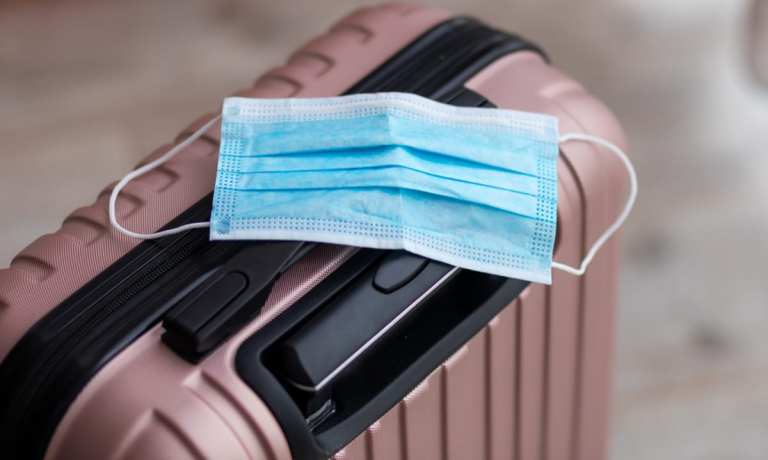 face mask on suitcase