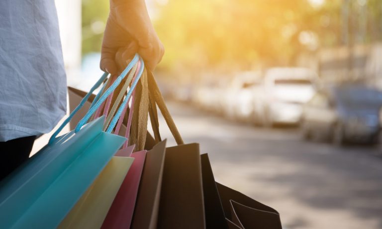 consumer with shopping bags