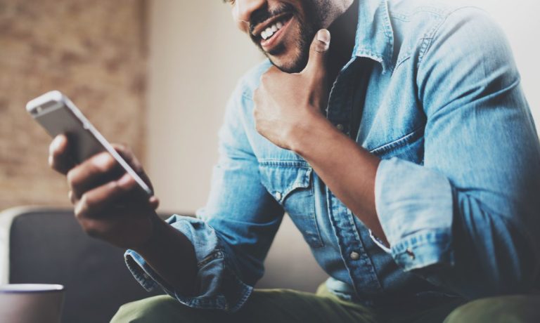 man looking at smartphone