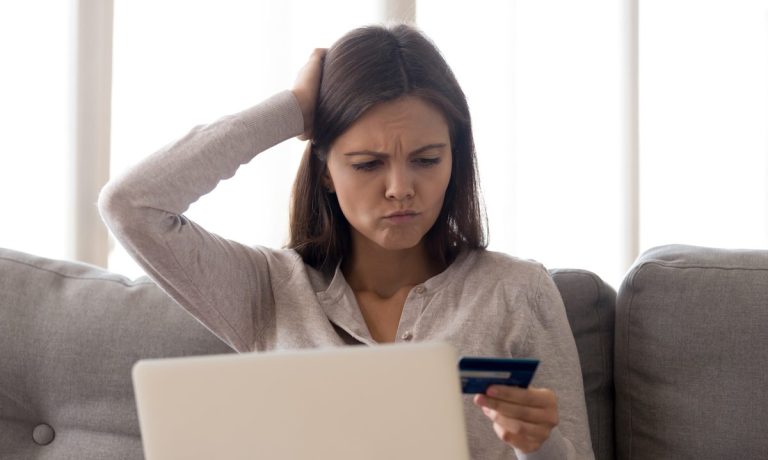 puzzled woman seeing bank fraud