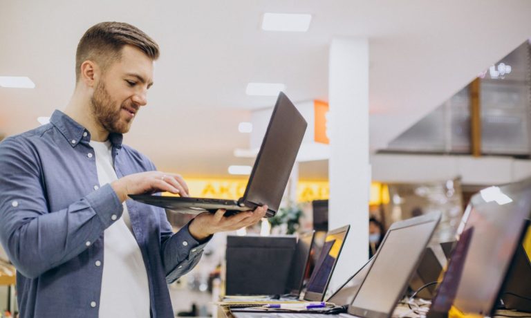 man shopping for laptop computer