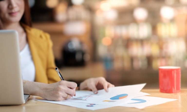 businesswoman looking at financials