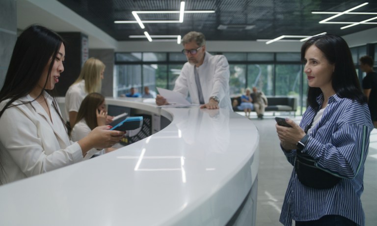 woman paying at medical office