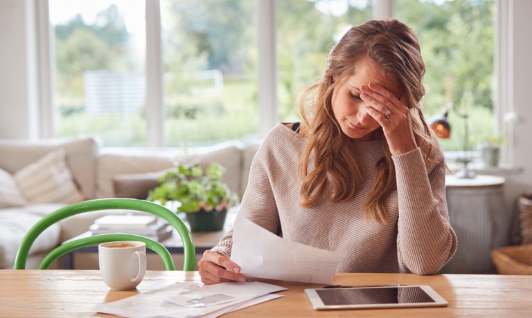 woman worried over bank fees