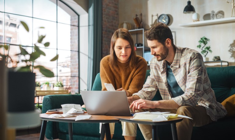 couple working on budget, paying bills