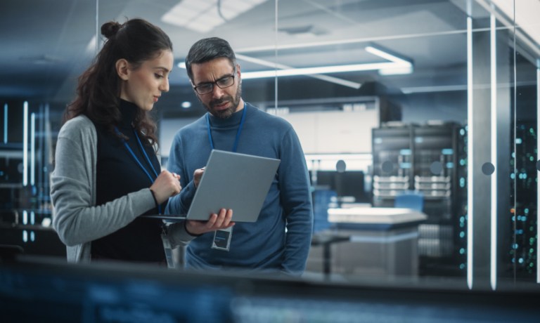 two businesspeople with laptop