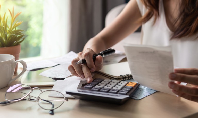 businesswoman adding expenses