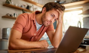 sad man with laptop