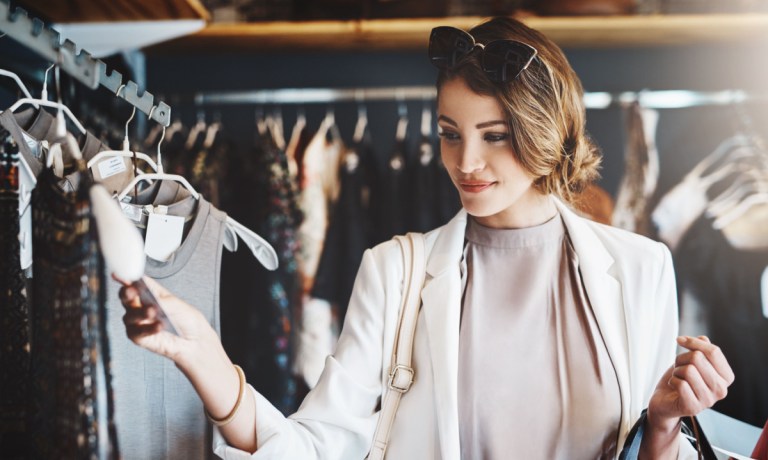 woman clothes shopping, checking tag