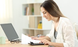 woman working on household budget