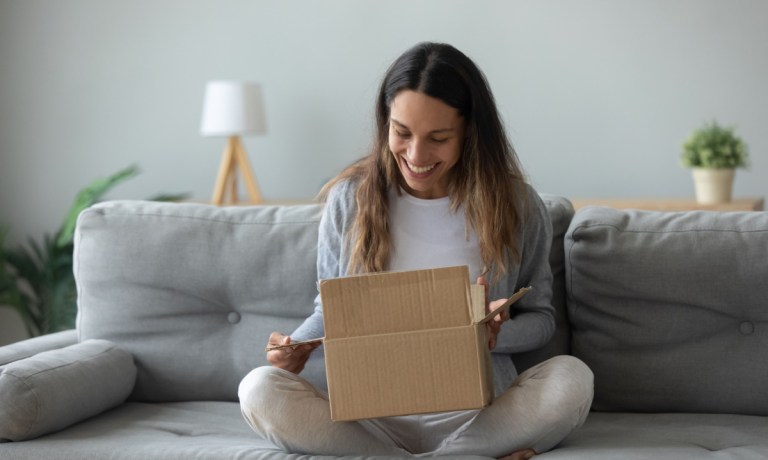 woman opening box