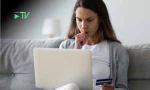 woman paying online, worried