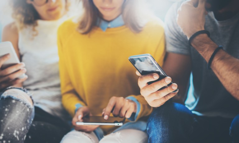 young people with phones, tablet