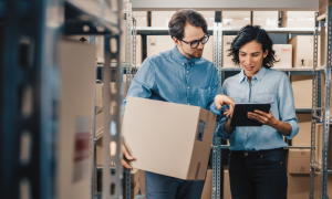 two retail workers in warehouse with inventory