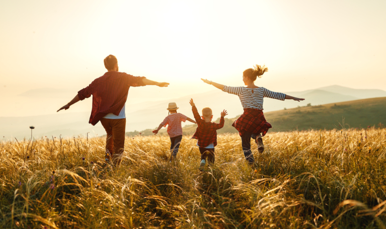 parents with kids in field