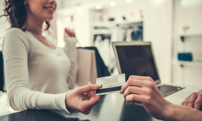 woman paying at store