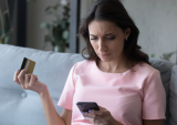 worried woman with credit card