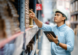 worker taking inventory in warehouse