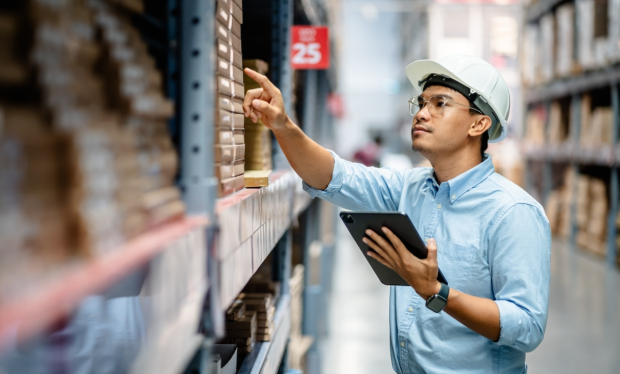 worker taking inventory in warehouse