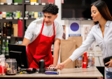 woman paying at store