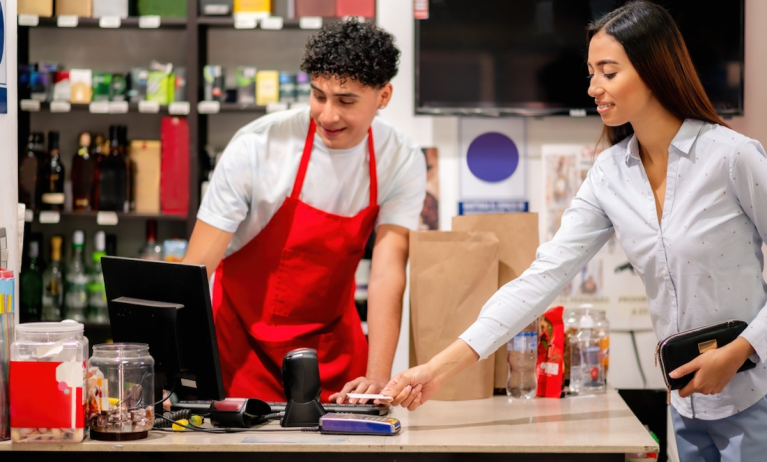 woman paying at store