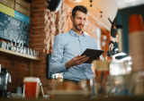 restaurant manager with tablet