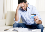 man with credit card bills