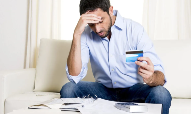 man with credit card bills