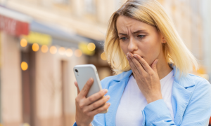 upset woman with phone