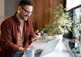 man with phone and laptop