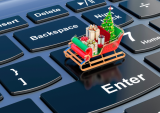 tiny sleigh on computer keyboard