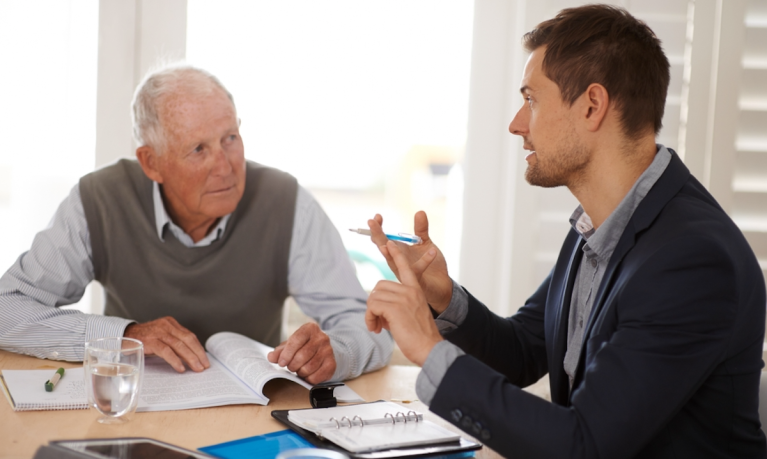 young man and older man with finances